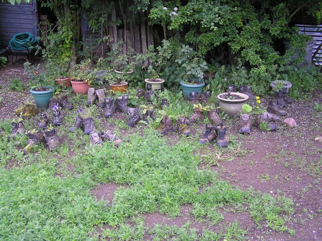Just outside Kirk Yetholm, planters made of old walking boots